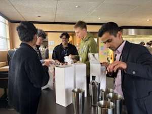 HIgh School students learning how to make mocktails with shakers